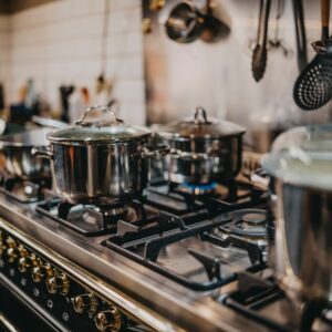 stainless steel cooking pots on gas stove