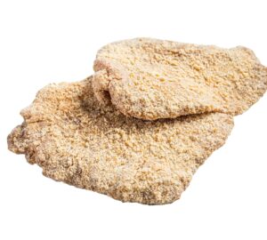 Raw chicken schnitzel Escalope in breadcrumbs. Isolated on white background.