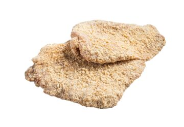 Raw chicken schnitzel Escalope in breadcrumbs. Isolated on white background.