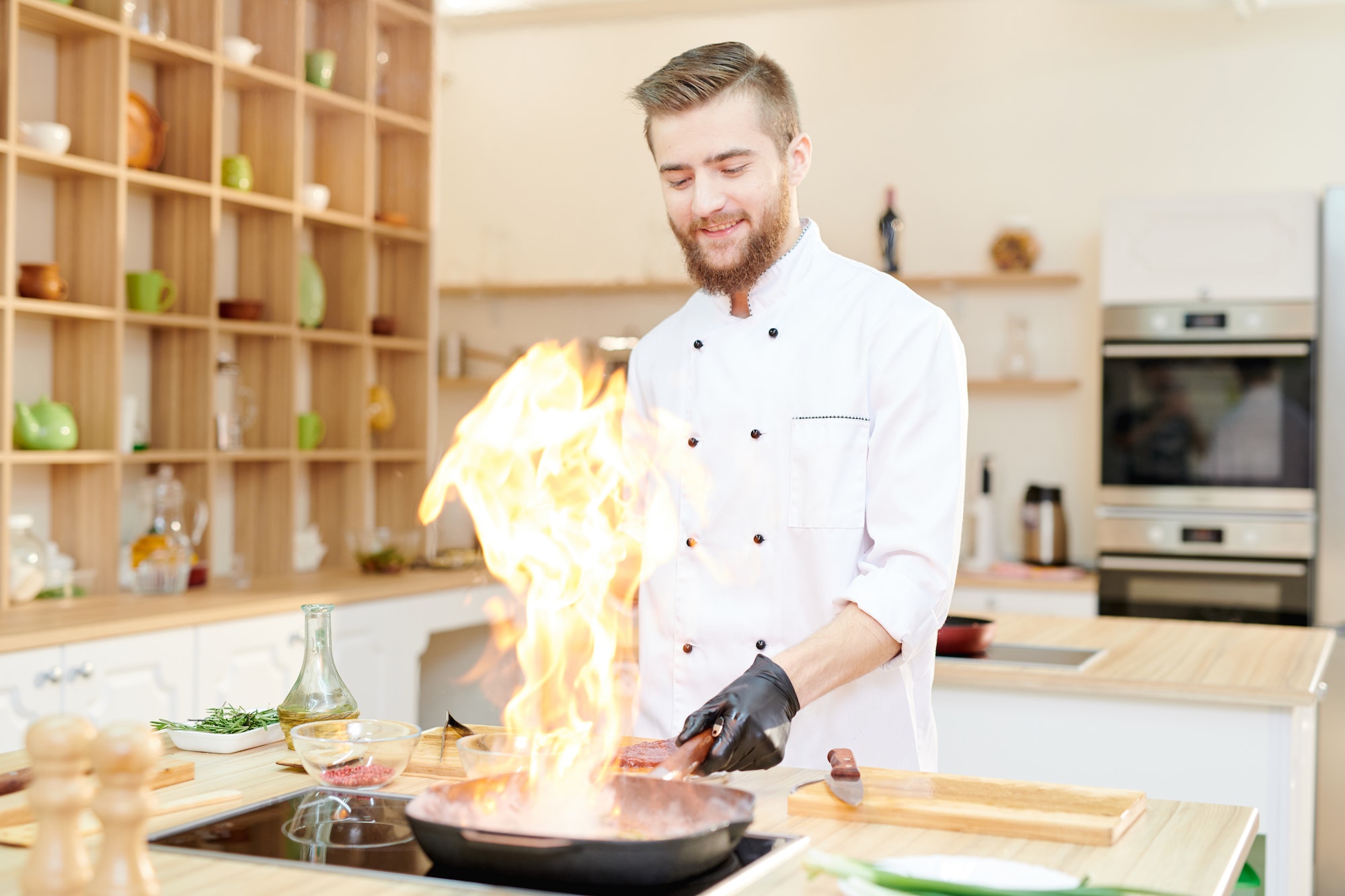 Smiling Chef Cooking Flambe