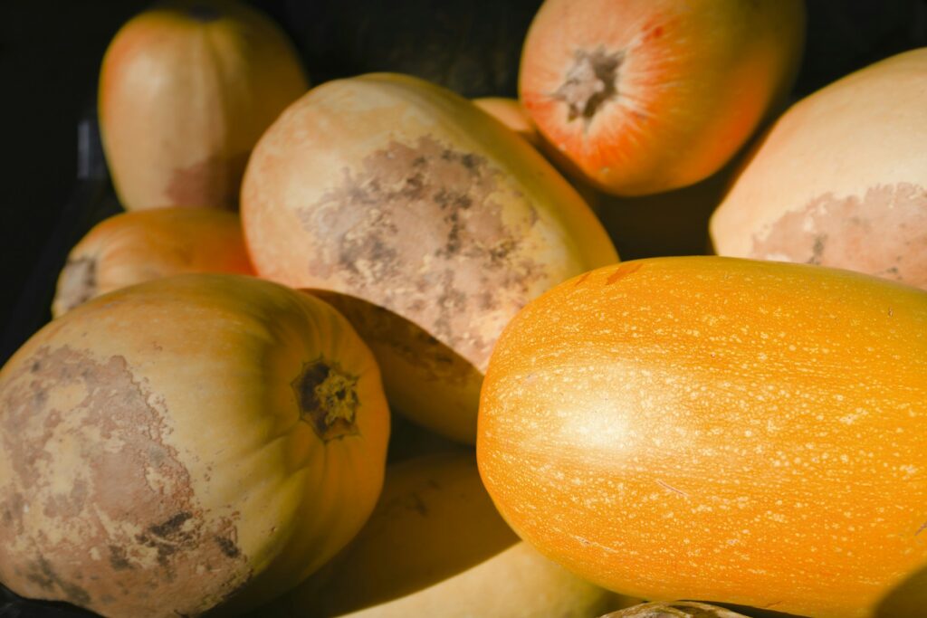 Close-up of golden winter squash at a farmers market